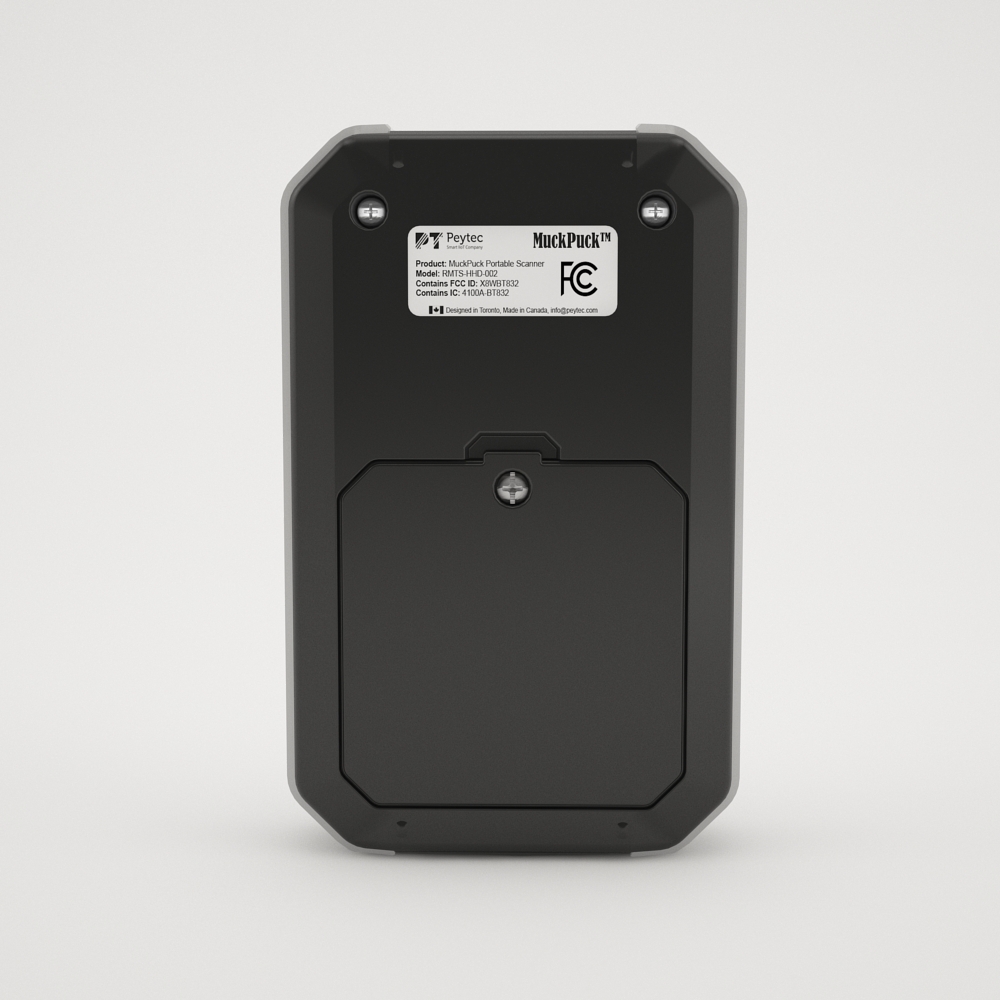 Rear of the MuckPuck Portable Scanner showing its identification label and battery cover.
