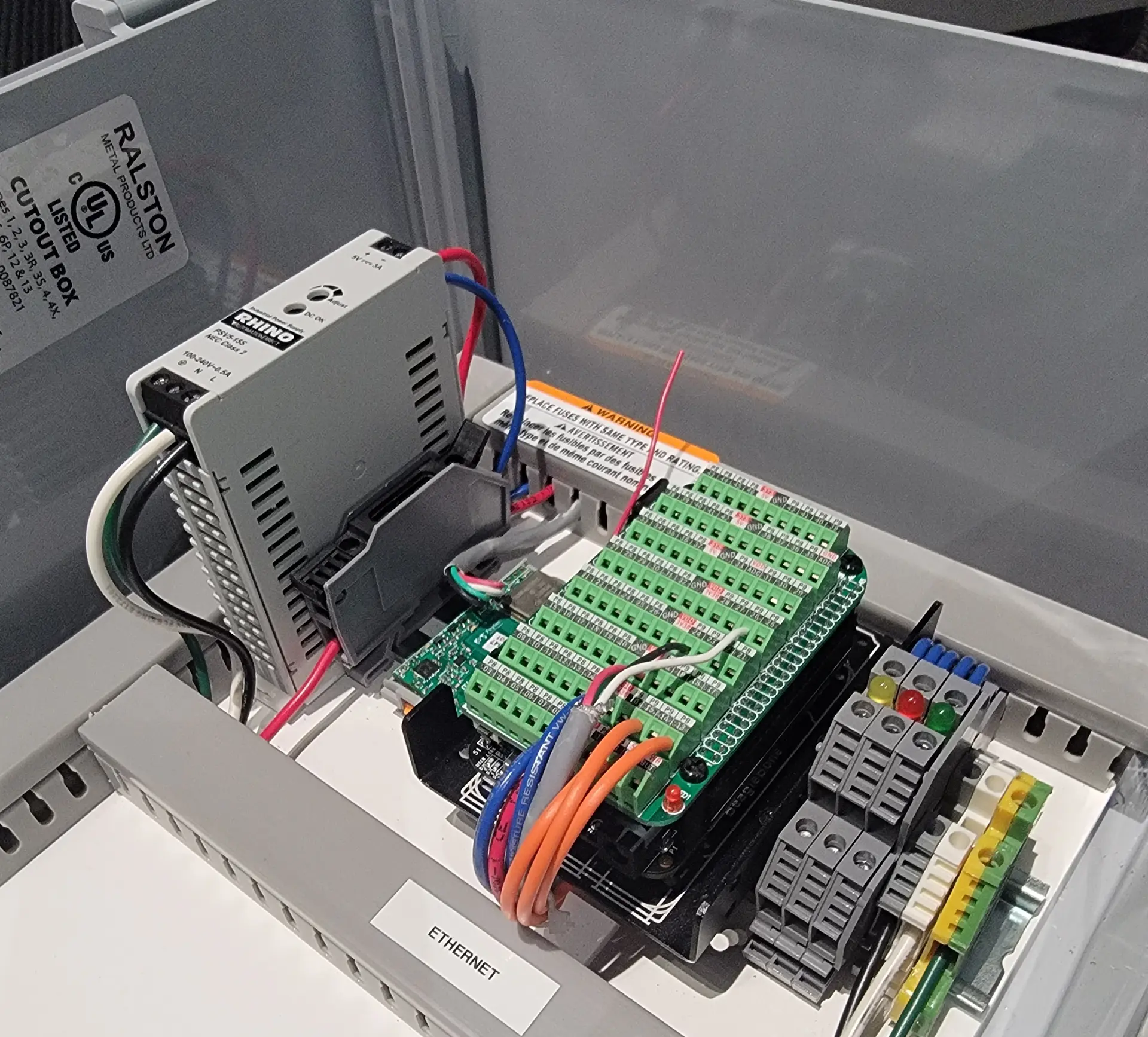 Interior of the Industrial Online Smart Gateway showing its installed electronics and terminal connections.